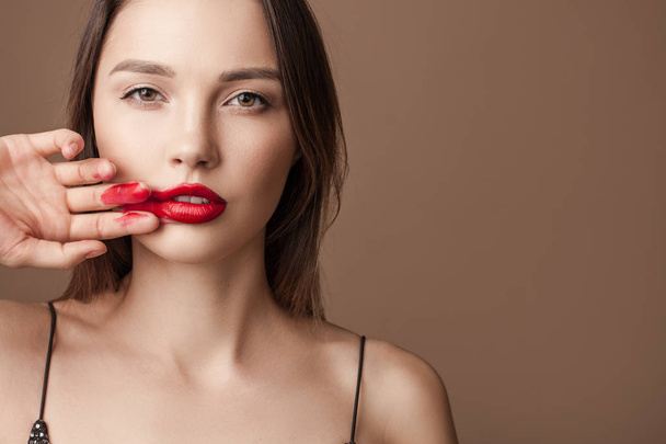 Portrait of a sensual woman. copycpase red lipstick on her face - Φωτογραφία, εικόνα
