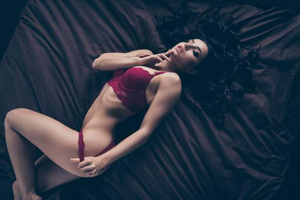 Close up top above high angle view photo beautiful satisfies touch herself self she her lady wife perfect ideal shapes lying sheets nude hand arm take off red bikini boudoir panties indoors bedroom - Φωτογραφία, εικόνα