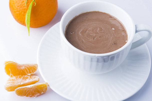 hot chocolate in mug with mandarins - Fotó, kép