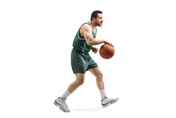 Basketball player running with a ball  - Фото, зображення
