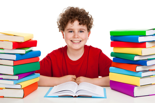 Student with pile of books - Photo, image
