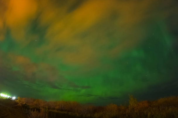 Aurora borealis in night northern sky. Ionization of air particl - Photo, Image