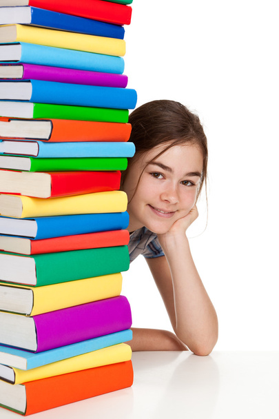 Student sitting near pile of books - Fotó, kép