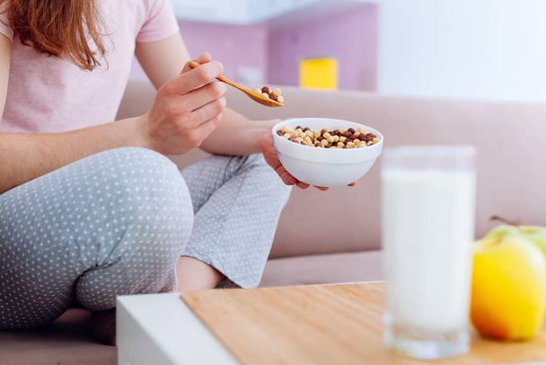 Cereals healthy crisp breakfast of bowl full of frosted chocolate balls, yellow apple and fresh glass of milk - Фото, зображення