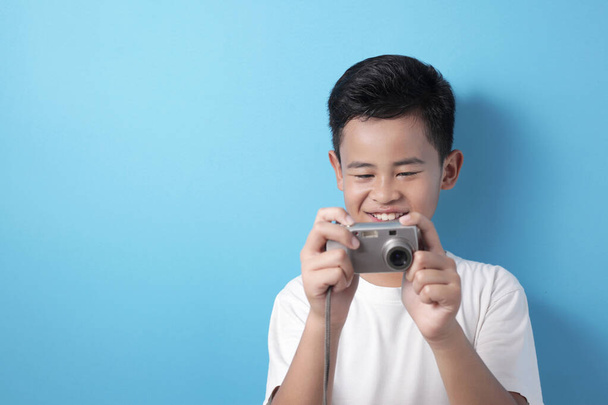 Happy Asian boy doing photography - Photo, Image