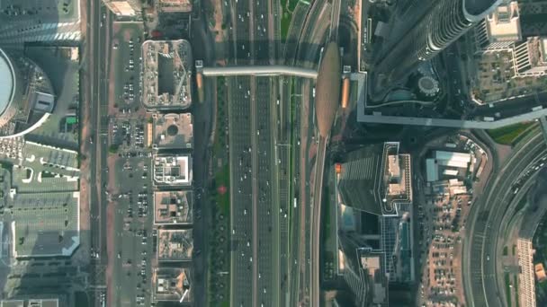 Aerial down view of a busy city highway interchange in Dubai Downtown, UAE - Felvétel, videó