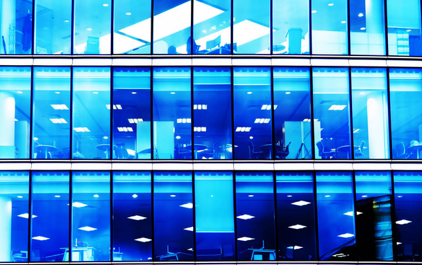 modern office building with blue lights background - Zdjęcie, obraz