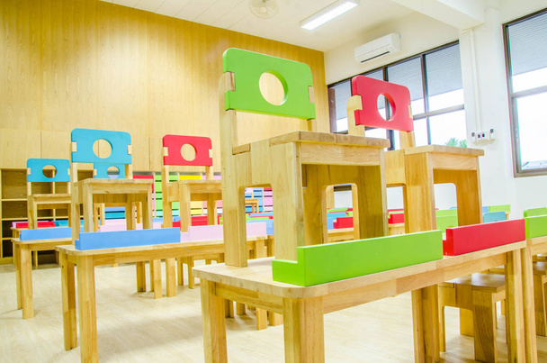 Desks and chairs in the kindergarten classroom. - Photo, Image
