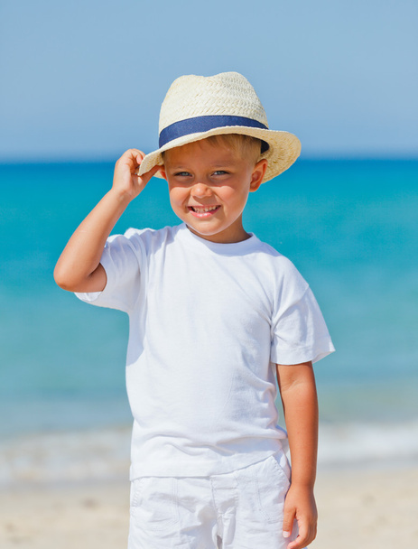 Boy with hat on the beach - Photo, image