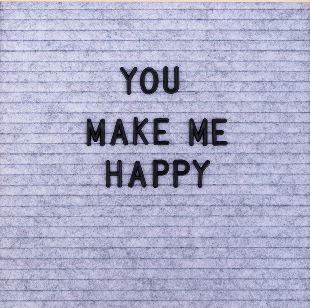 The words You Make Me Happy on grey felt letter board - 写真・画像