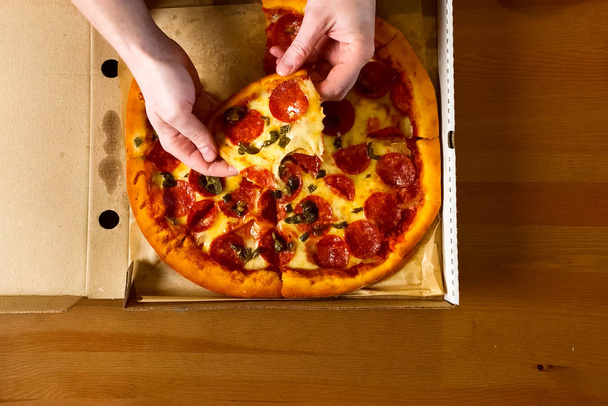 Delivered pizza in box, delicious pizza. - Photo, Image