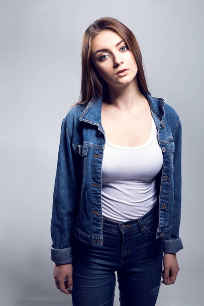 Young sexy woman in jeans jacket, white shirt - Фото, зображення
