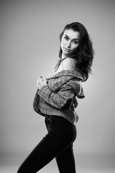 Studio portrait of a beautiful young woman in trendy clothing - Foto, immagini