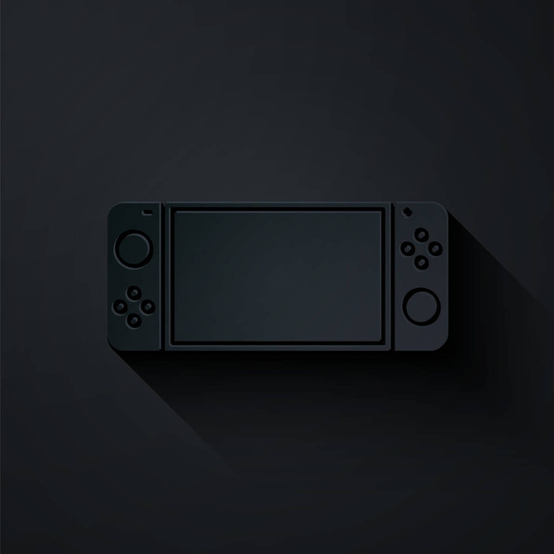 Corte de papel Icono de consola de videojuegos portátil aislado sobre fondo negro. Señal de mando. Concepto de juego. Estilo de arte de papel. Ilustración vectorial - Vector, Imagen