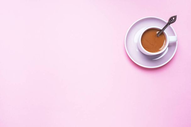 A Cup of coffee on a pink background with copy space. Top view. minimalism. - Photo, Image