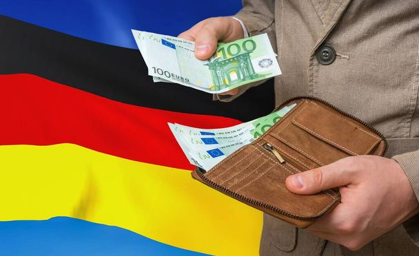 Investing money to Germany. Rich man with a lot of money. - Zdjęcie, obraz