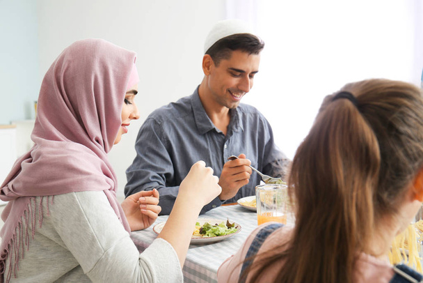 Muslim family having dinner at home - Фото, зображення