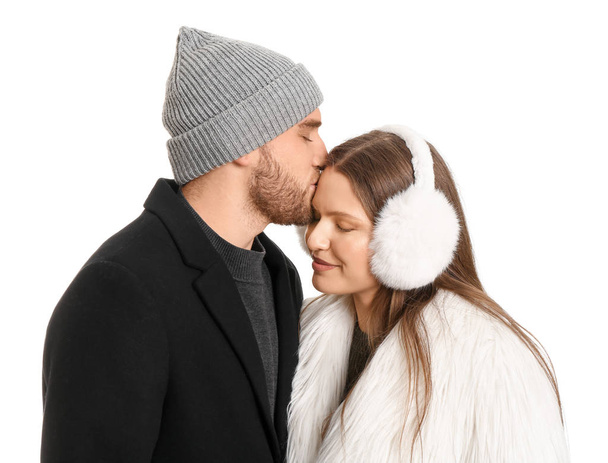 Portrait of happy couple in winter clothes on white background - Zdjęcie, obraz