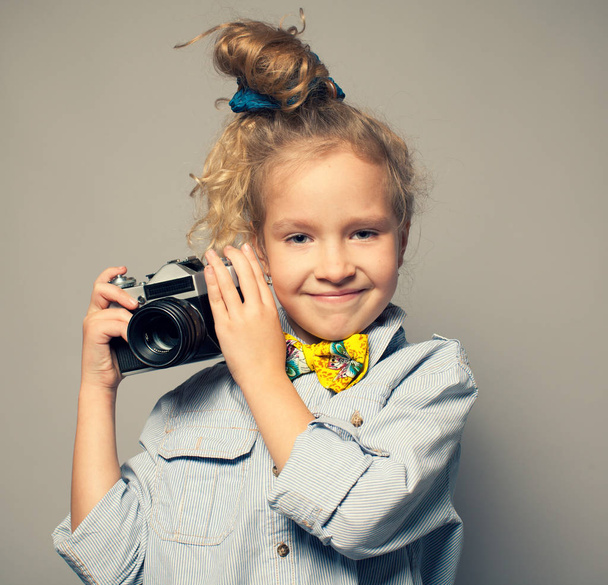 Child with camera. - Фото, изображение