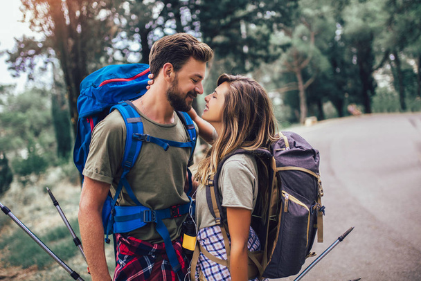 Romantic couple hiking on the path in mountains - Foto, imagen