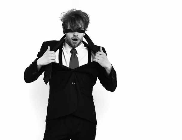 Bearded macho stylish man in elegant suit with blindfold eyes - Фото, изображение