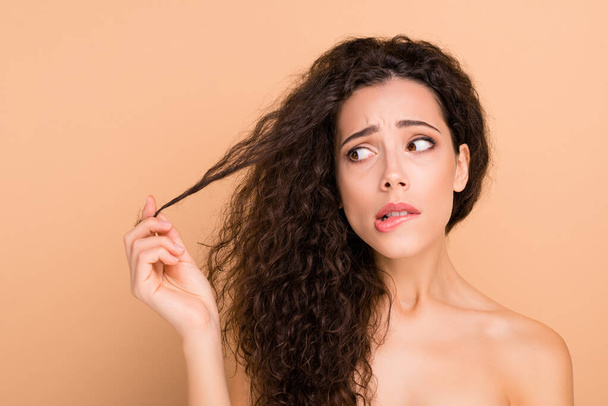 Close-up portrait of her she nice attractive lovely nervous depressed frustrated wavy-haired girl touching showing medicine curls disaster isolated over beige pastel background - Foto, Imagem