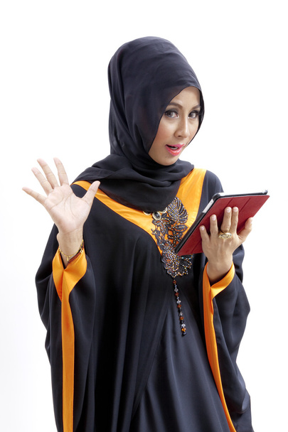 Muslim asian female student with tablet computer - Photo, image