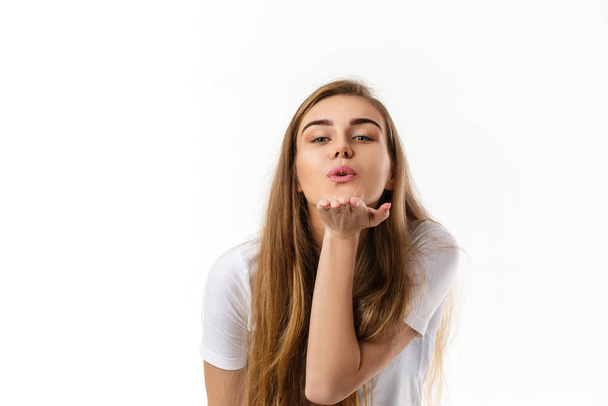 Cute young woman sending kiss - Fotoğraf, Görsel