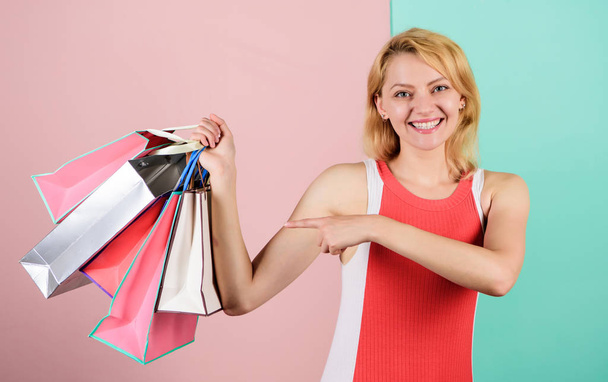 Retail and consumerism. Ecology impact. Satisfied with her shopping. Discounts and loyalty program. Real sale. Woman on shopping tour. Girl with paper bags. Black friday concept. Happy shopping day - Photo, Image