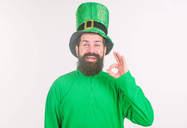 All is well. Irish man with beard in green gesturing ok sign. Happy saint patricks day. Bearded man celebrating saint patricks day. Hipster in leprechaun hat and costume - Φωτογραφία, εικόνα