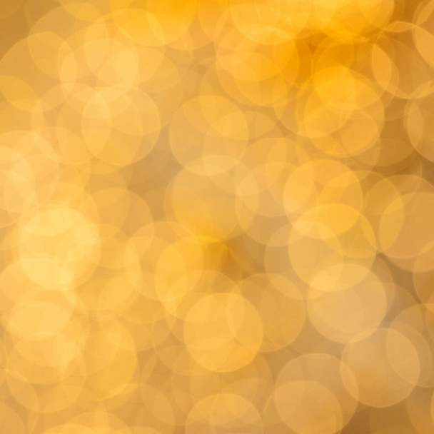 Golden sparkling lights festive background.  - Фото, изображение