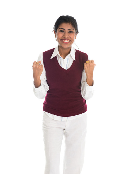 casual indian female in sweater celebrating success - Photo, Image