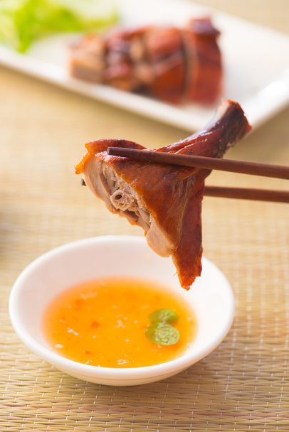 Chinese asian roast duck with chopstick and sauce - Fotografie, Obrázek