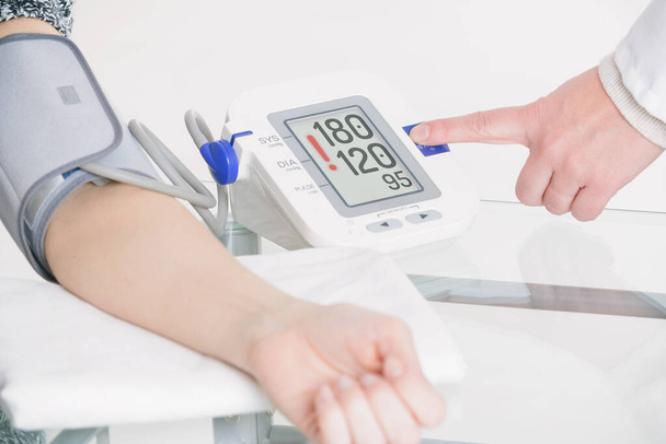 Doctor measuring blood pressure  - Photo, Image
