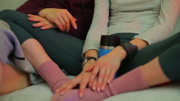 Hands of LGBT partners sitting on a sofa at home. - Záběry, video