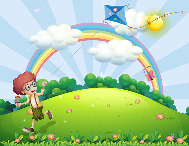 Un ragazzo che gioca con il suo aquilone in cima alla collina con un arcobaleno
 - Vettoriali, immagini