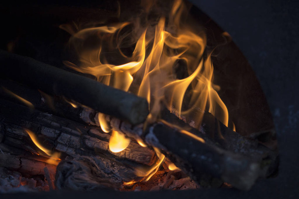 Firewood burns in the stove - Фото, изображение