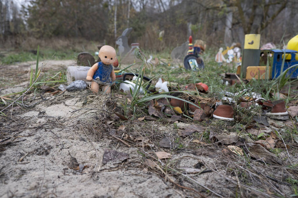 Chernobyl pripiat old toys abandoned on the street dolls - Photo, Image