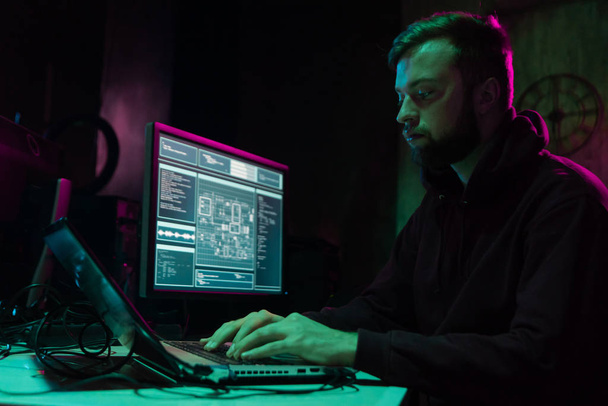 Hackers making cryptocurrency fraud using virus software and computer interface. Blockchain cyberattack, ddos and malware concept. Underground office background. - Photo, Image