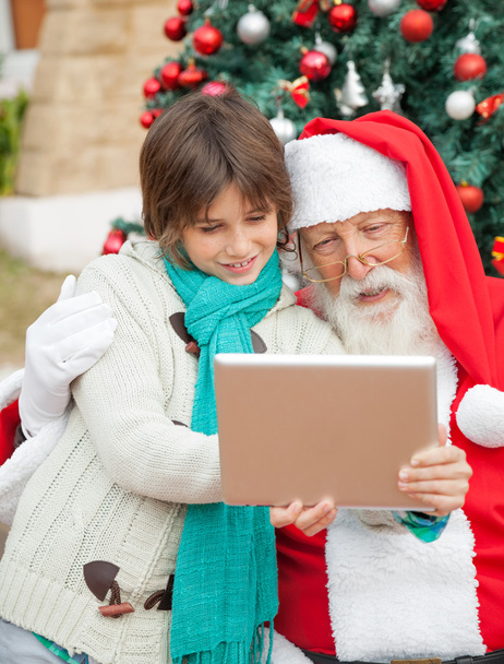 Santa Claus Using Digital Tablet With Boy - Foto, imagen