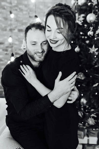 Romantic couple in love feeling happiness about their romance spending christmas eve together, - Foto, Imagem