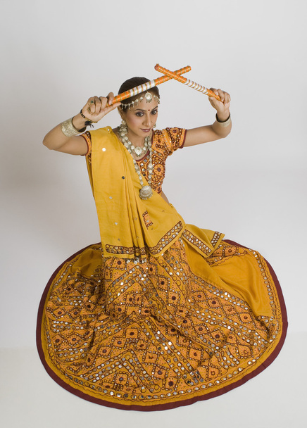 Woman performing dandiya - Фото, изображение
