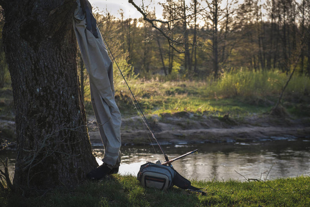 Fishing tackle on the background of the river - 写真・画像