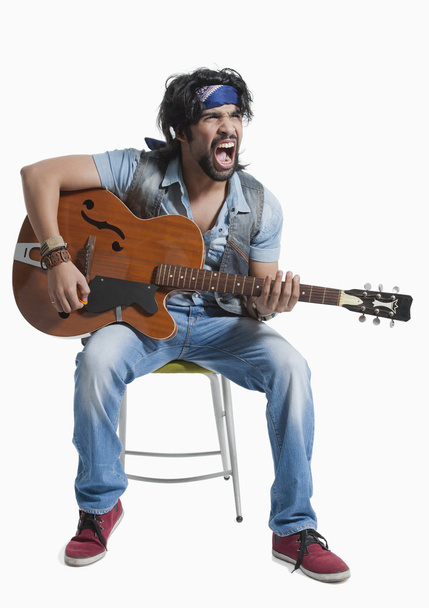 Musician playing a guitar - Photo, Image