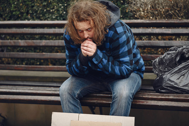 Homeless man in a durty clothes autumn city - Φωτογραφία, εικόνα