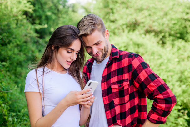 communication concept. couple in love. Blogging concept. navigator search. romantic date online. man pry phone of girl. Jealousy. personal space concept. Got lost. couple use smartphone outdoor - Fotoğraf, Görsel