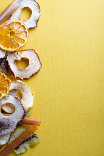 Dried fruits on a yellow background and place for an inscription - Photo, Image