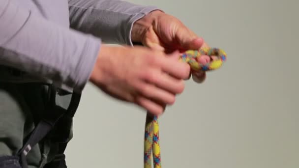 Climber tying with a Figure of Eight knot - Part 1 - Footage, Video