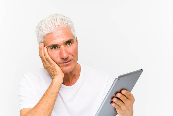 Mature caucasian man holding a tablet - Photo, Image