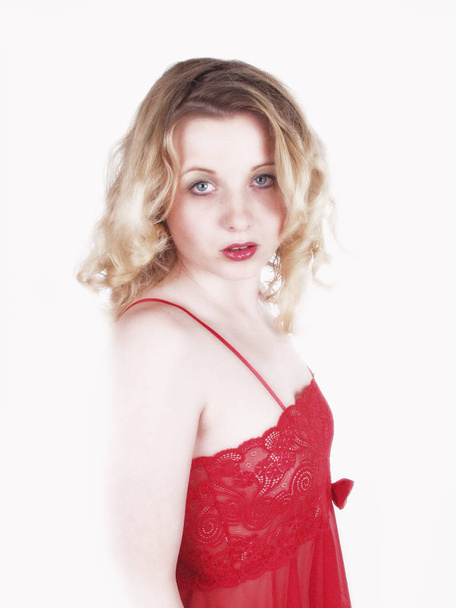portrait of a beautiful young woman in a red dress - Zdjęcie, obraz